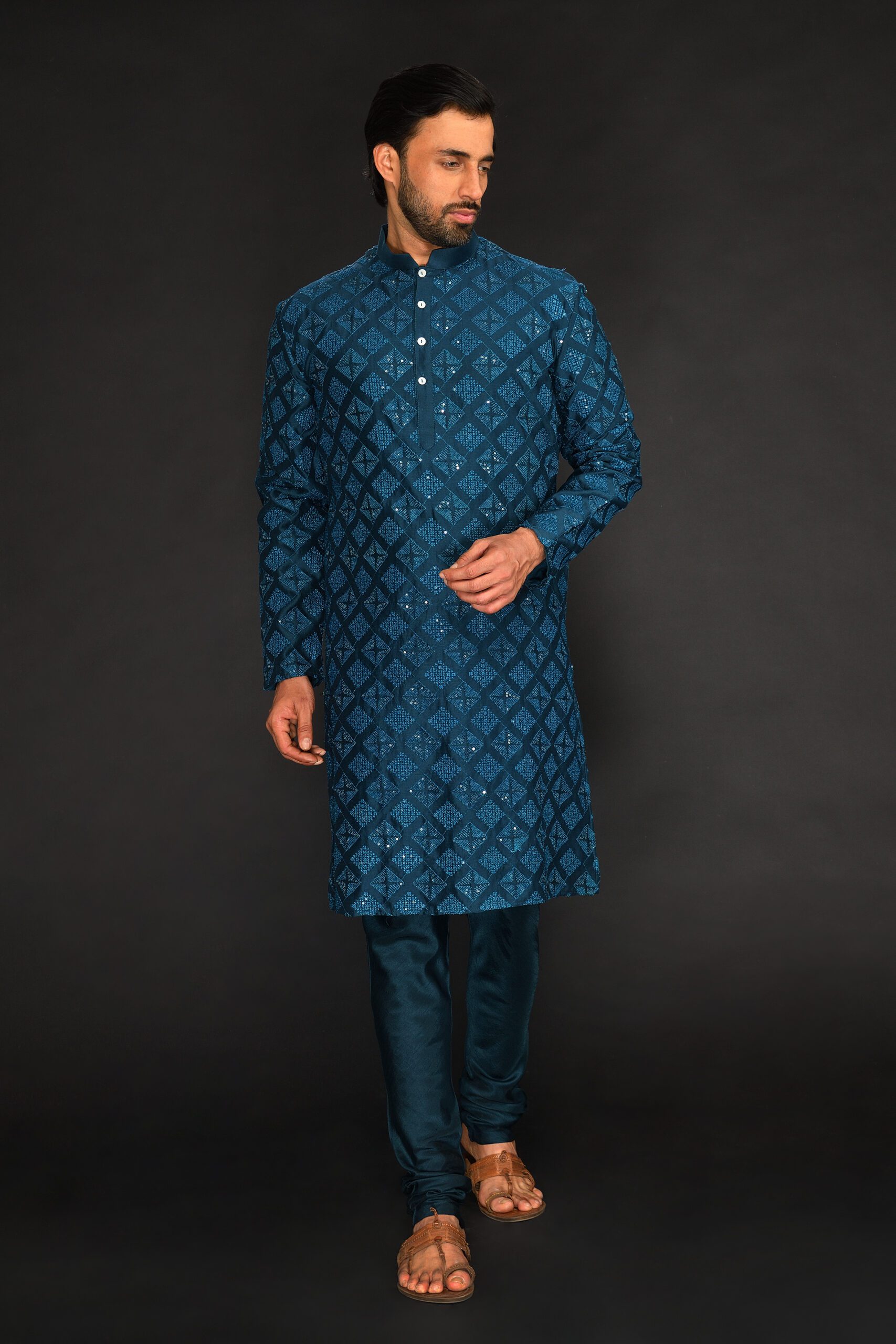 TEAL BLUE PURE CHANDERI MACHINE TEXTURED EMBROIDERED KURTA PAIRED WITH CHUDIDAR PANTS